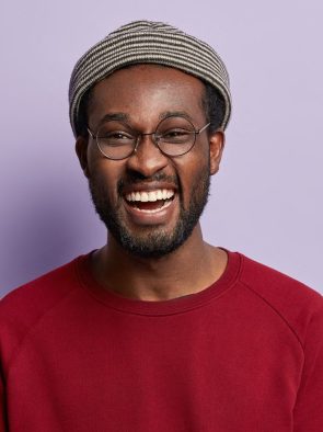 photo-of-satisfied-man-with-thick-bristle-being-in-high-spirit-enjoys-free-time-with-friend-shows-e1627313447336.jpg